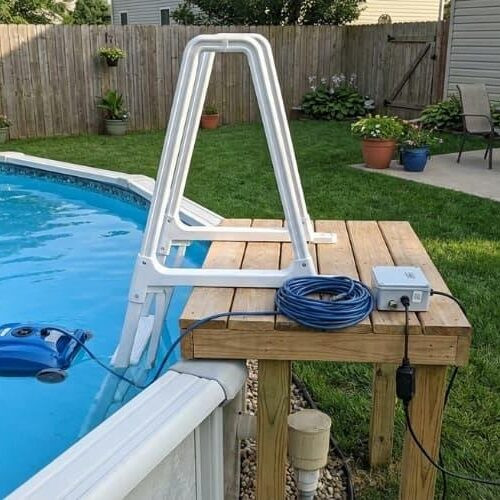 A robotic cleaner in an above ground pool designed for simple access and easy setup