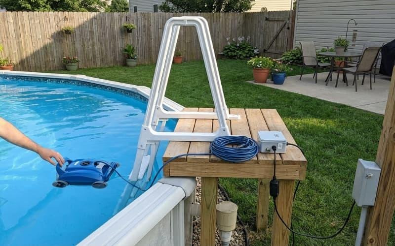 A robotic cleaner in an above ground pool designed for simple access and easy setup